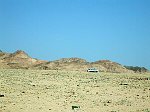 A lorry driving through the dessert, probably on the way to Sharm el Sheik.